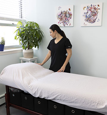 Lauradonna D'Antoni, owner of Body Restoration Physical Therapy preparing patient treatment area